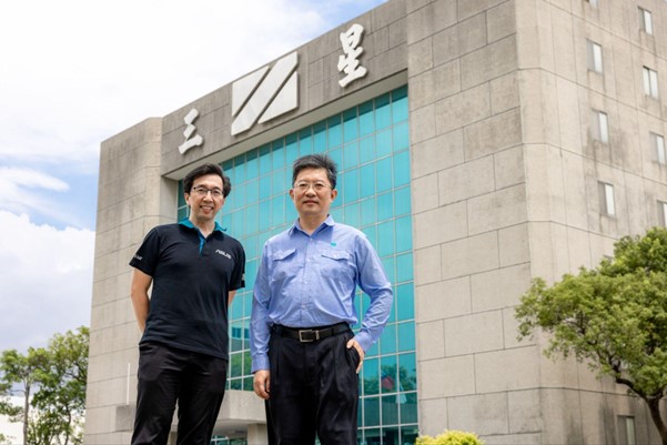 Chen Xin-zhi, GM of San Shing Fastech Corp and Ku Ying-Hsien, Deputy Division Director of ASUS side by side standing in front of the San Shing Fastech office building
