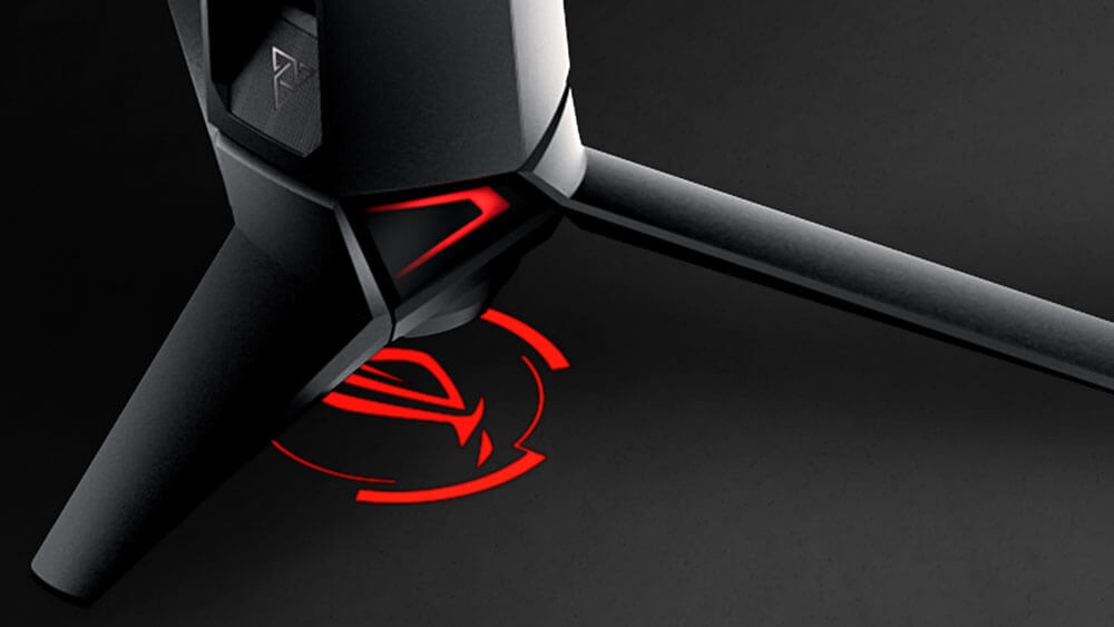 Product photo showing the projected ROG logo on the underside of the monitor stand.