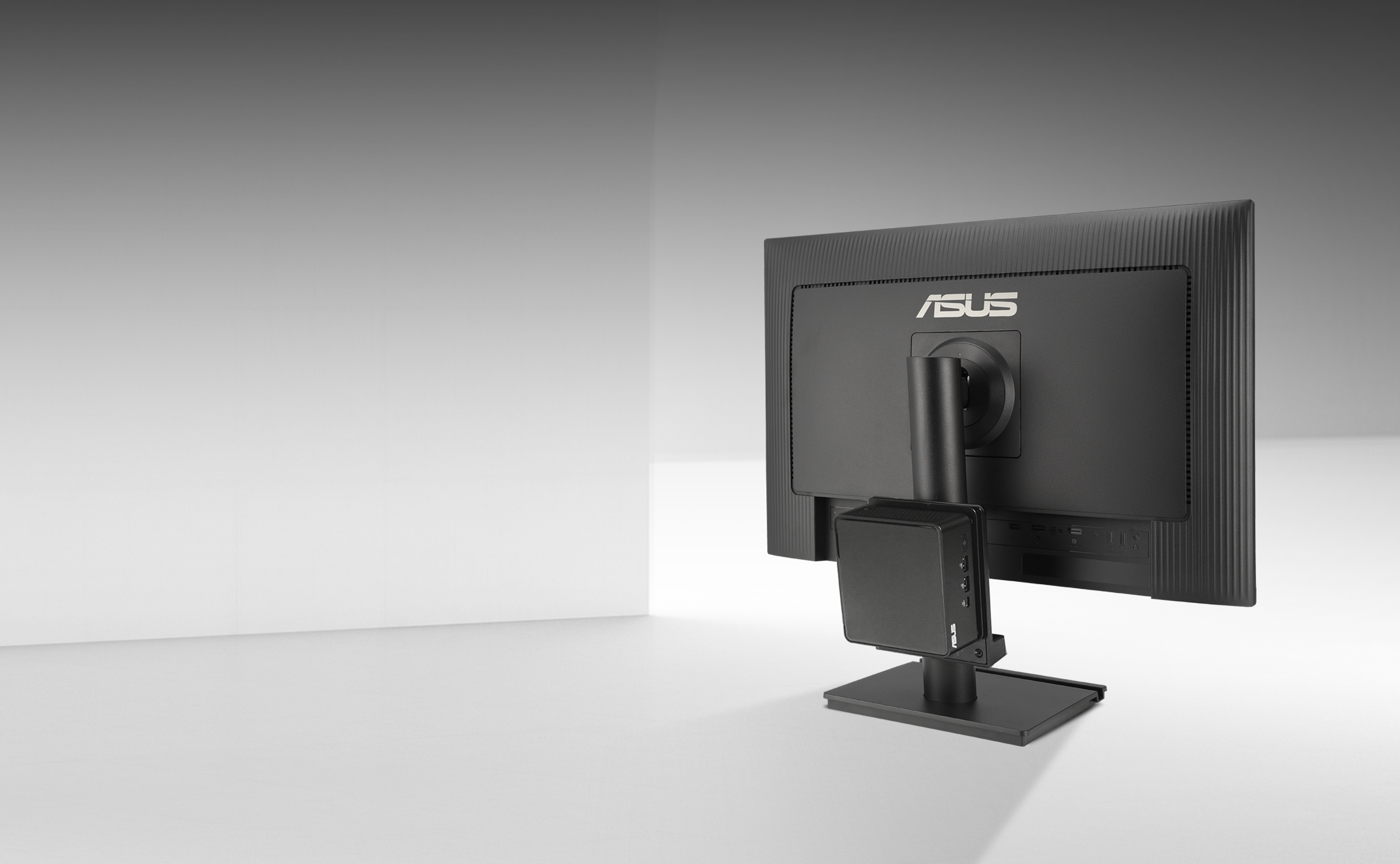 A mini PC can be attached to the rear of the ASUS BE248CFN monitor