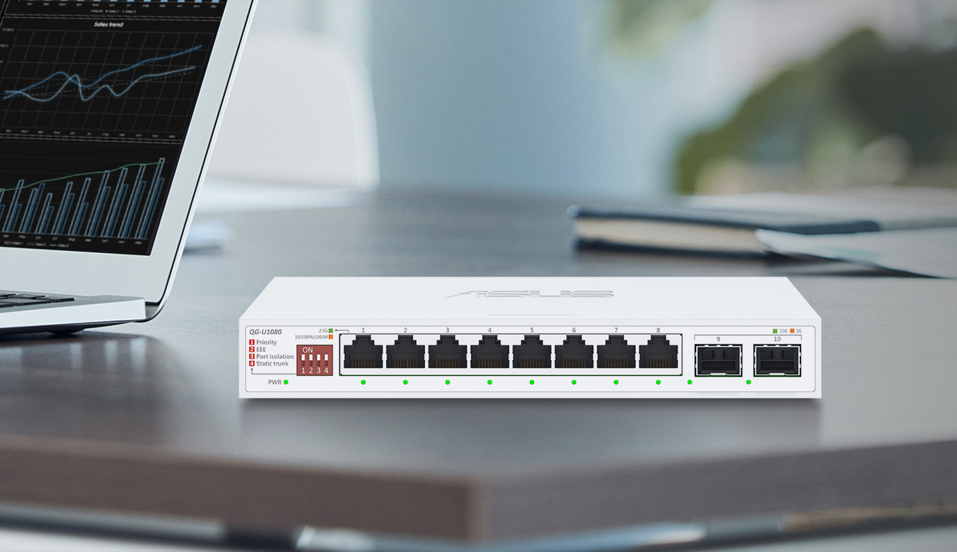 A QG-U1080 switch is placed on an office desk.