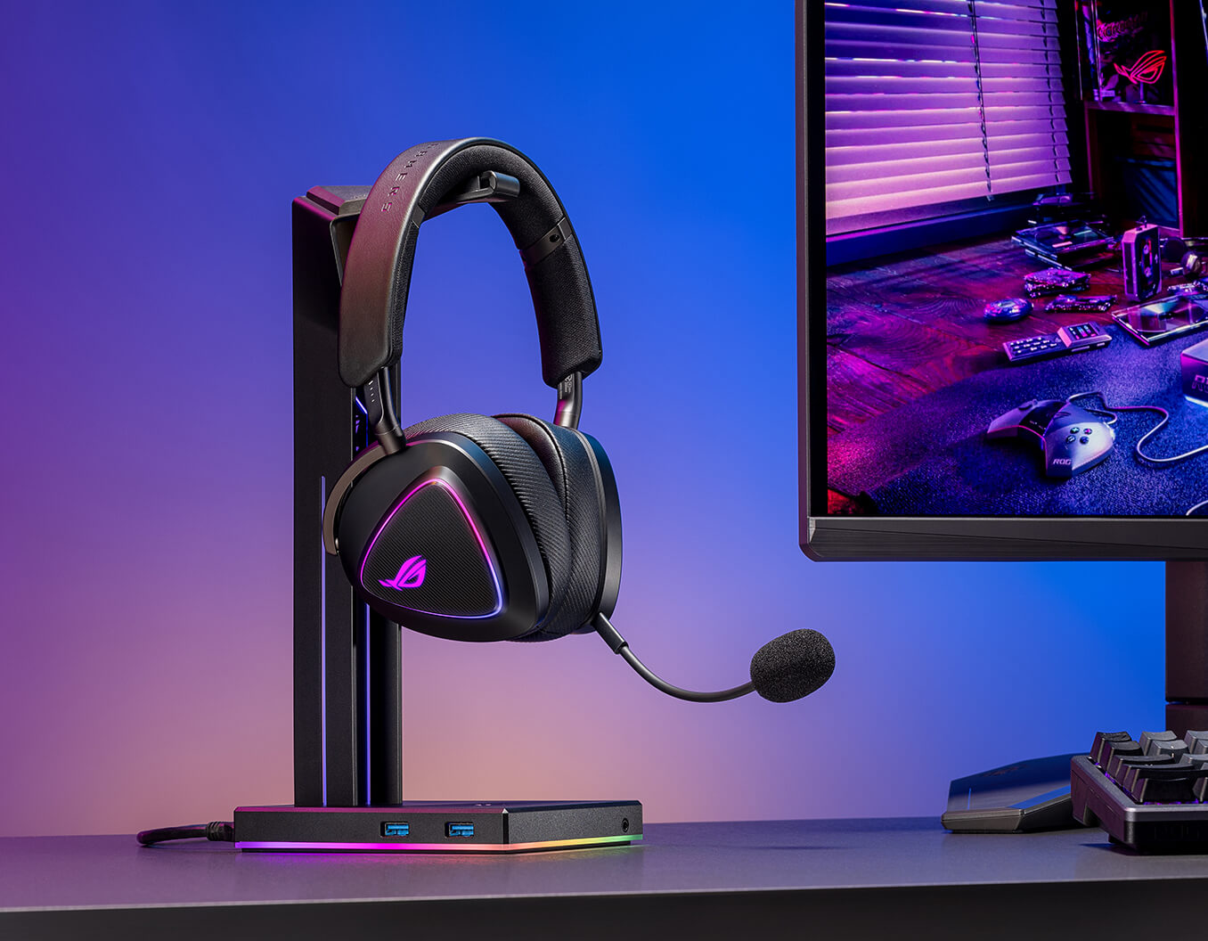 The ROG Delta II on the headset stand beside to the ROG monitor and keyboard on the right.