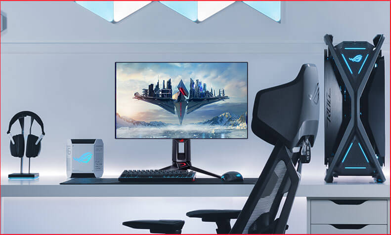 An ROG gaming setup featuring a PG27AQDP along with a keyboard, mouse, headset, and PC